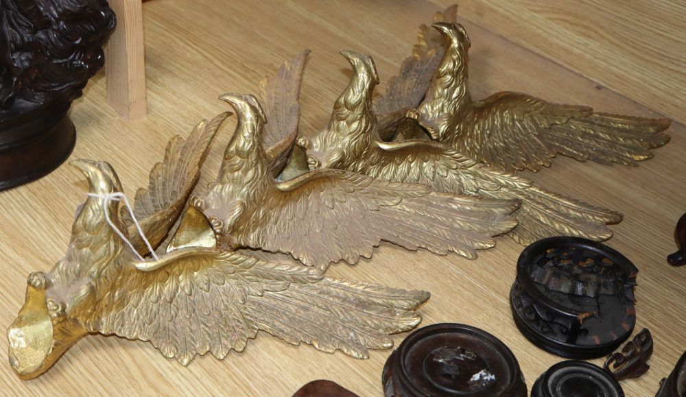 A set of four gilt metal eagle mounts, length 32cm